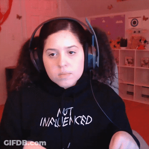 Woman In Headphones And Black Sweatshirt Saying Not Influenced GIF