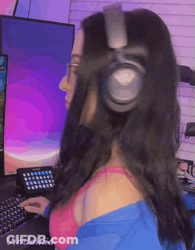 Woman In Headphones And Bra At Computer GIF