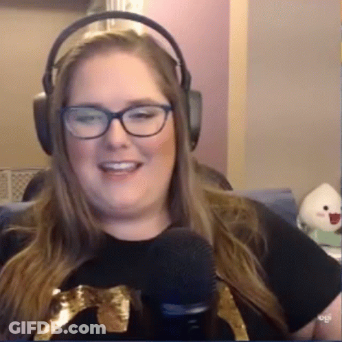 Woman In Headphones And Glasses Smiling At Microphone GIF