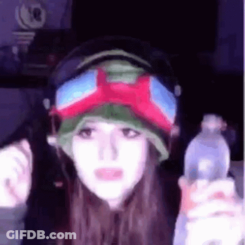Woman In Headphones And Goggles Holding Water Bottle GIF