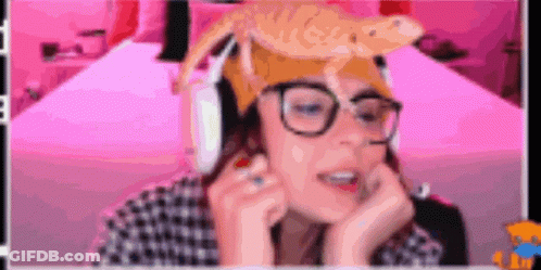 Woman In Headphones And Hat With Lizard GIF