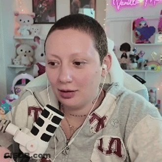 Woman In Headphones And Hoodie At Microphone GIF