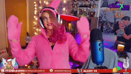 Woman In Headphones And Pink Gloves At Alchy 19 Sign GIF