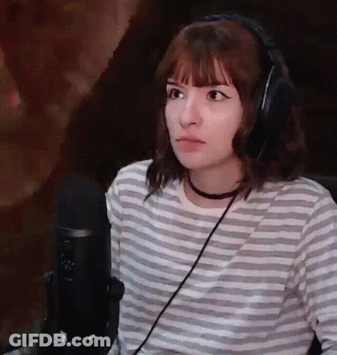 Woman In Headphones And Striped Shirt At Microphone GIF