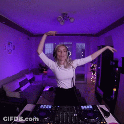 Woman In Headphones And White Shirt At DJ Controller GIF