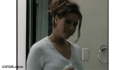 Woman In Headphones And White Sweater GIF