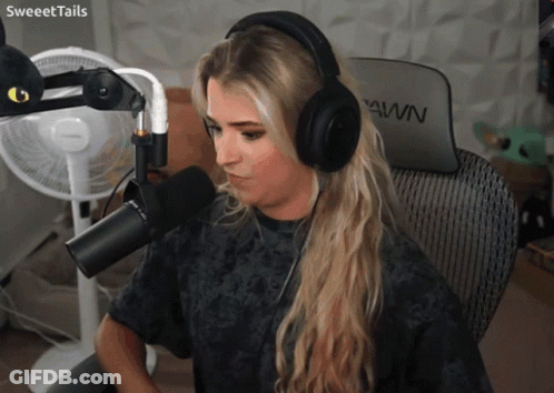 Woman In Headphones At Microphone With Pawn Chair GIF