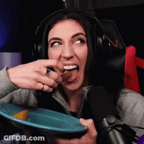 Woman In Headphones Eating From Blue Plate GIF