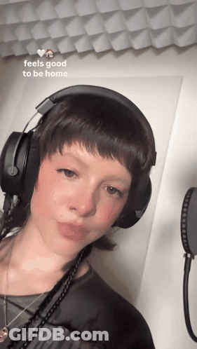 Woman In Headphones Feels Good To Be Home GIF