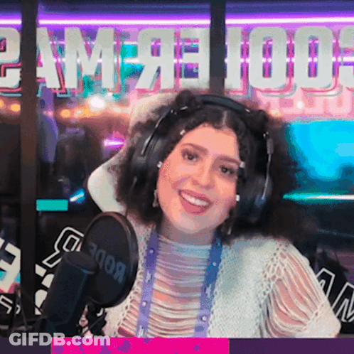 Woman In Headphones In Front Of Rode Microphone GIF