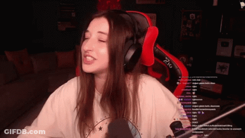 Woman In Headphones In Red And Black Gaming Chair GIF