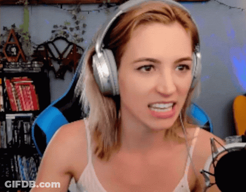 Woman In Headphones Making Funny Face At Microphone GIF