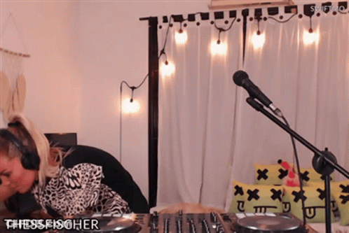 Woman In Headphones Playing DJ Set Thessfischer GIF