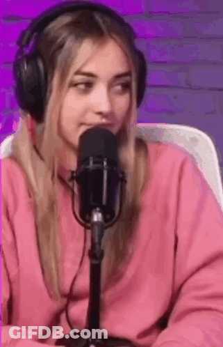 Woman In Headphones Sitting At Microphone GIF