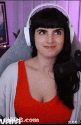 Woman In Headphones Sitting In Chair GIF