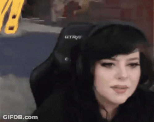 Woman In Headphones Sitting In Chair With GTR GIF