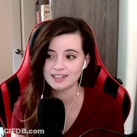 Woman In Headphones Sitting In Red Chair GIF