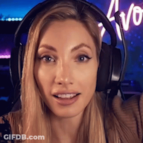 Woman In Headphones Smiling At Camera GIF