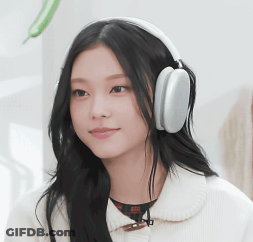 Woman In Headphones Smiling At Camera GIF