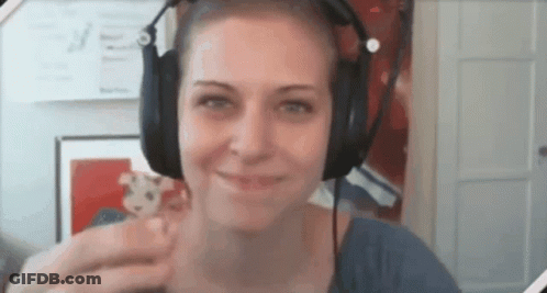 Woman In Headphones Smiling With Stuffed Animal GIF