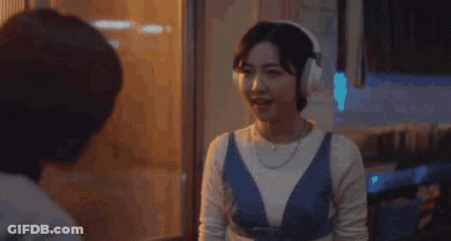 Woman In Headphones Talks To Woman Woo To Young To Woo GIF