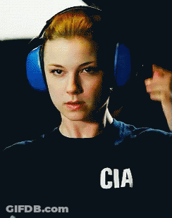 Woman In Headphones With CIA Shirt GIF
