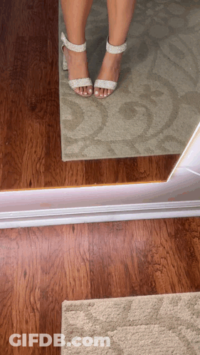 Woman In Heels At Mirror GIF