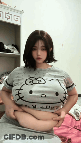Woman In Hello Kitty T-Shirt Holding Belly GIF