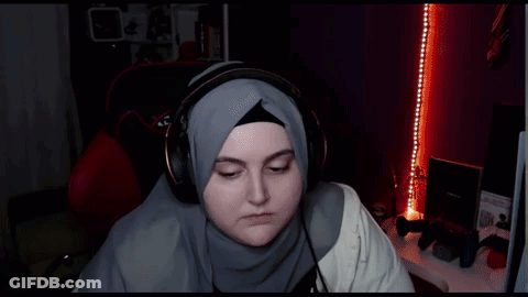 Woman In Hijab And Headphones In Xdrive Gaming Chair GIF