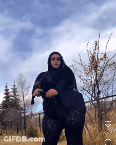 Woman In Hijab Holding Cat GIF