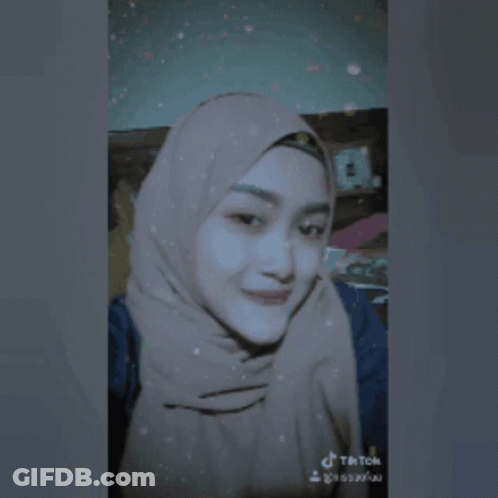 Woman In Hijab Taking Selfie GIF