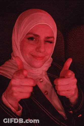 Woman In Hijab Thumbs Up Saying Pew Pew Pew GIF