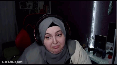 Woman In Hijab Wearing Headphones Making Face GIF