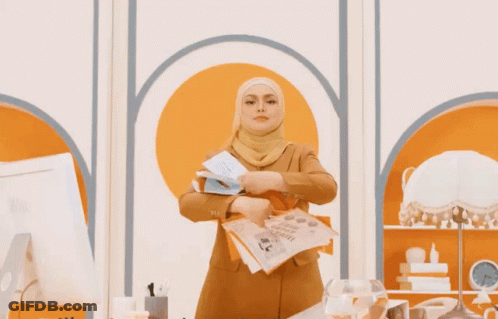 Woman In Hijab With Orange And White I Love You Papers GIF