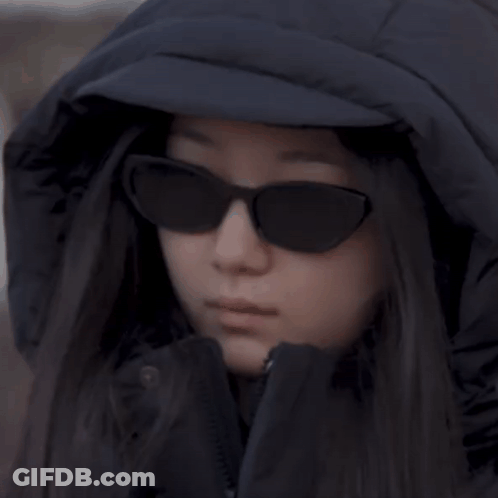 Woman In Hooded Jacket And Sunglasses GIF