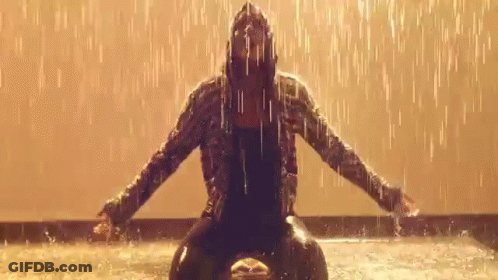 Woman In Hooded Jacket In Rain Arms Outstretched GIF