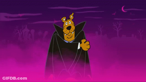 Woman In Hooded Jacket Next To Man In Mask On Dirt Road GIF