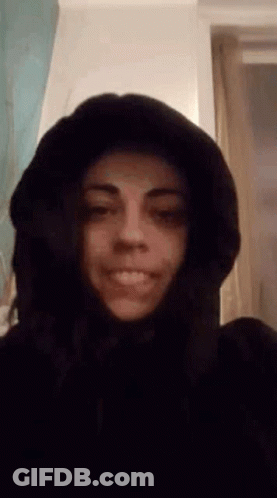 Woman In Hooded Jacket Smiling GIF