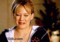 Woman In Hoodie And Necklace Making Funny Face GIF
