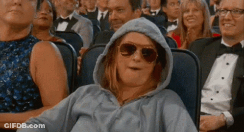 Woman In Hoodie And Sunglasses At Movie Theater GIF