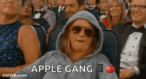 Woman In Hoodie And Sunglasses In Crowd Apple Gang GIF
