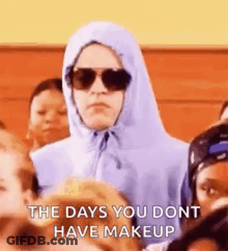 Woman In Hoodie And Sunglasses In Crowd GIF