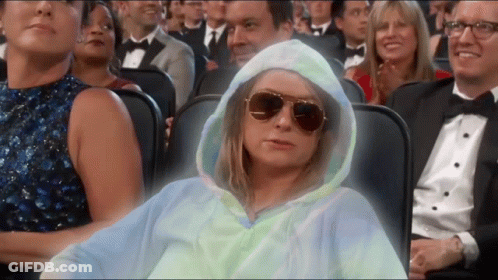 Woman In Hoodie And Sunglasses Sitting GIF