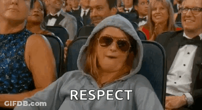 Woman In Hoodie And Sunglasses Watching Movie In Crowd GIF