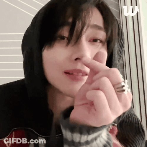 Woman In Hoodie Making Heart Shape GIF