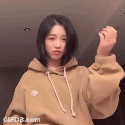 Woman In Hoodie With Smiley Face GIF