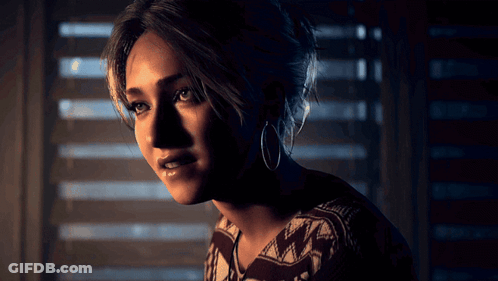 Woman In Hoop Earrings And Sweater By Window GIF