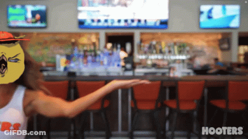 Woman In Hooters Shirt At Bar GIF