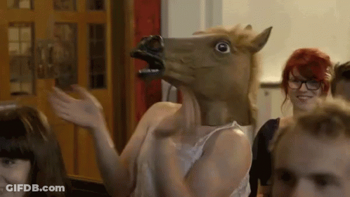 Woman In Horse Mask Waving At Group GIF