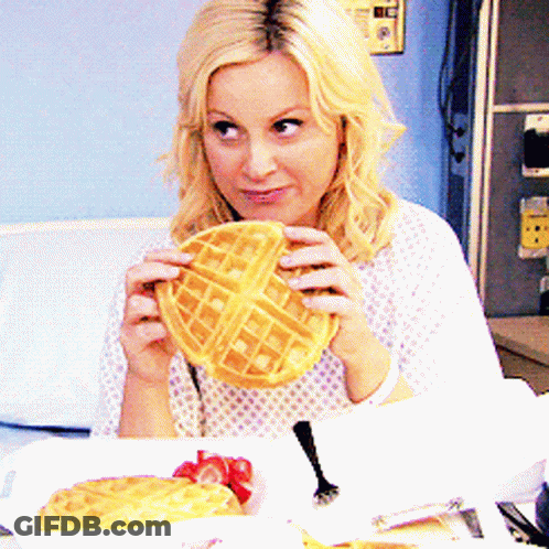 Woman In Hospital Gown Holding Waffle GIF